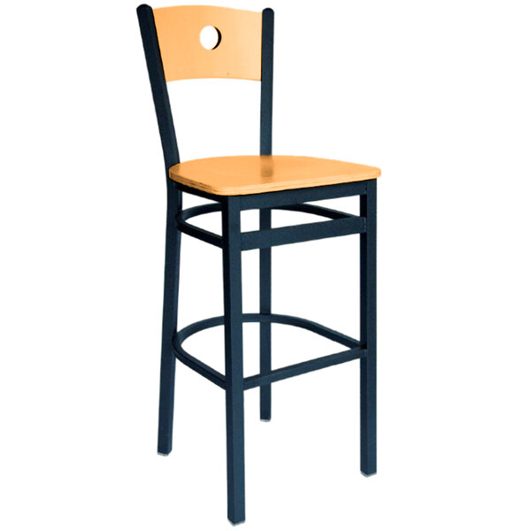 A BFM Seating black metal bar stool with a wooden back and seat.