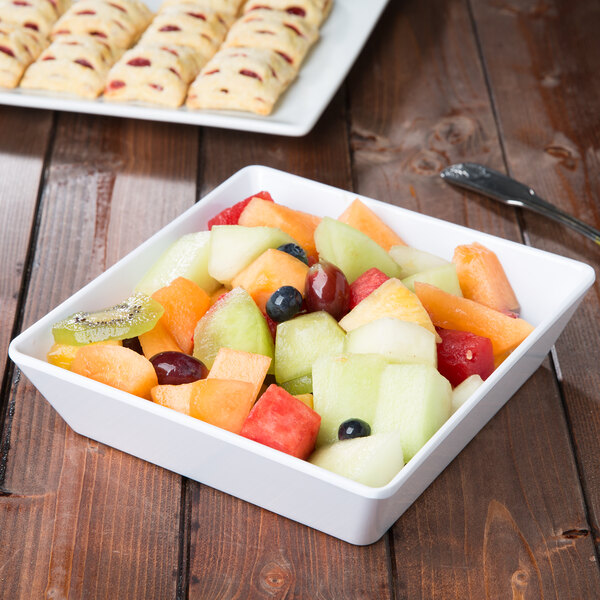 An American Metalcraft square melamine bowl filled with fruit