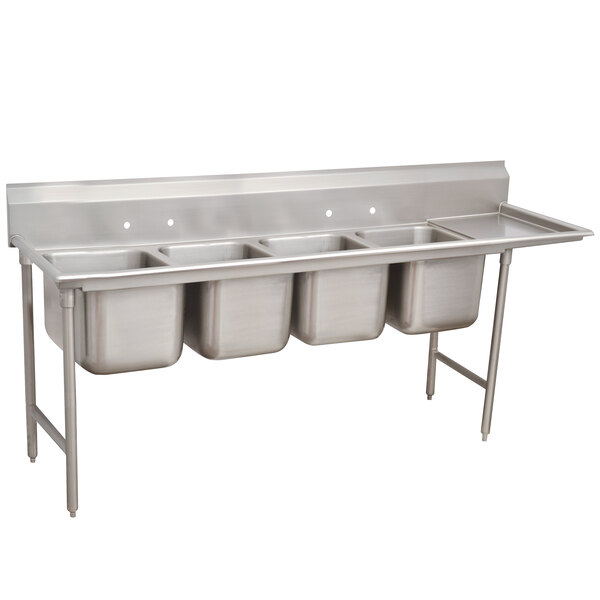 A stainless steel Advance Tabco four compartment pot sink with right drainboard.