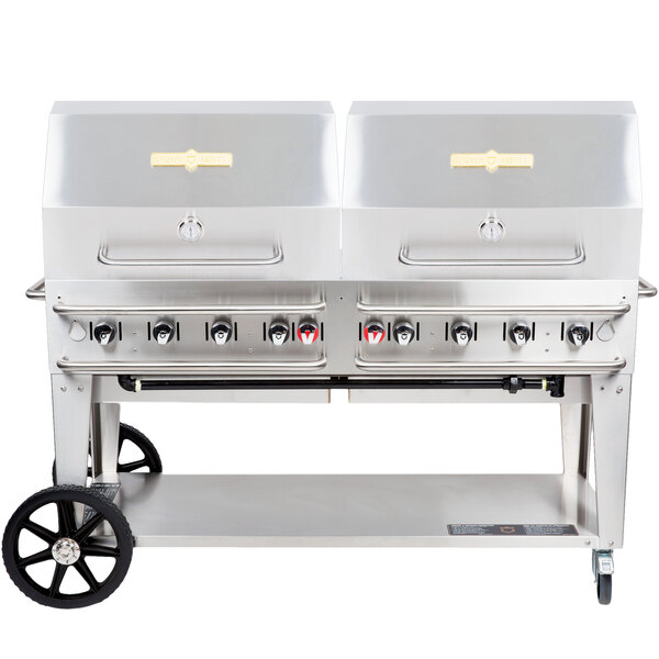 A large silver Crown Verity Pro Series outdoor grill on a cart with wheels.