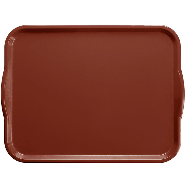 A brown rectangular Cambro tray with handles on a table.