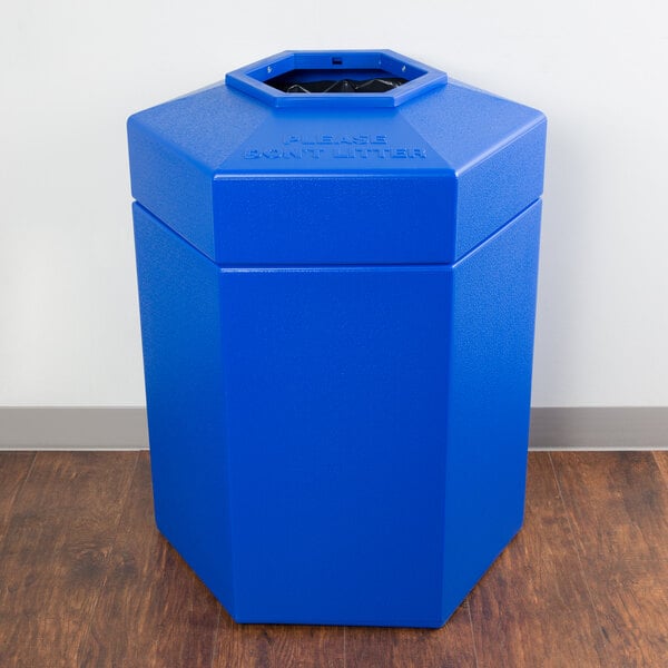 A blue hexagonal PolyTec trash can with an open top.