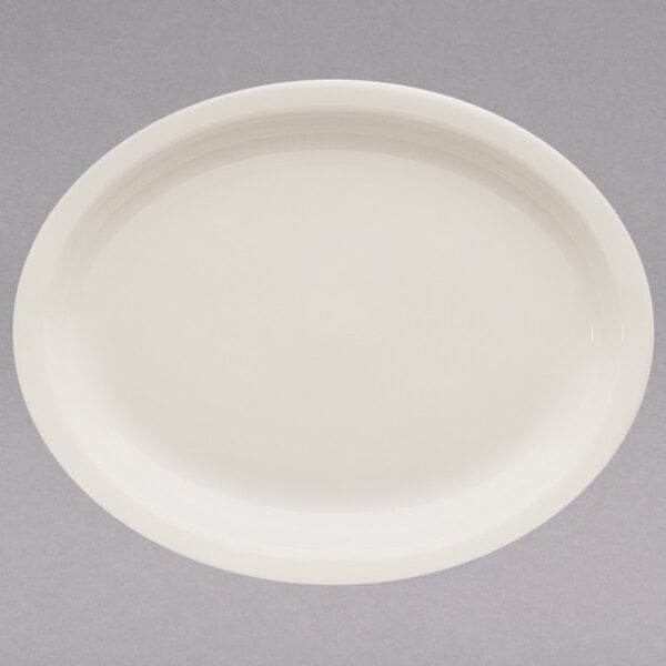 A white oval Homer Laughlin china platter with a narrow white rim.