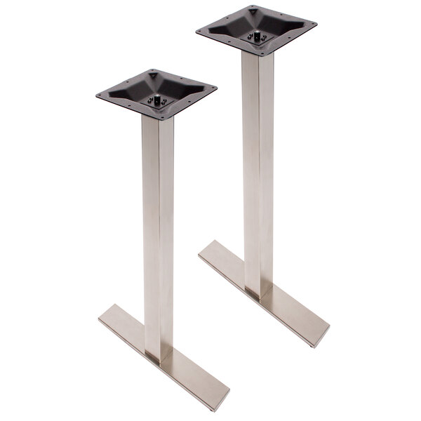 A pair of black metal square table bases with screws.