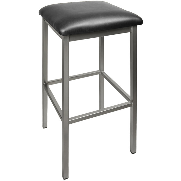 A BFM Seating bar stool with a black vinyl seat on a metal frame.