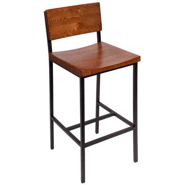 A BFM Seating Memphis bar height chair with a wooden back and seat and metal legs.