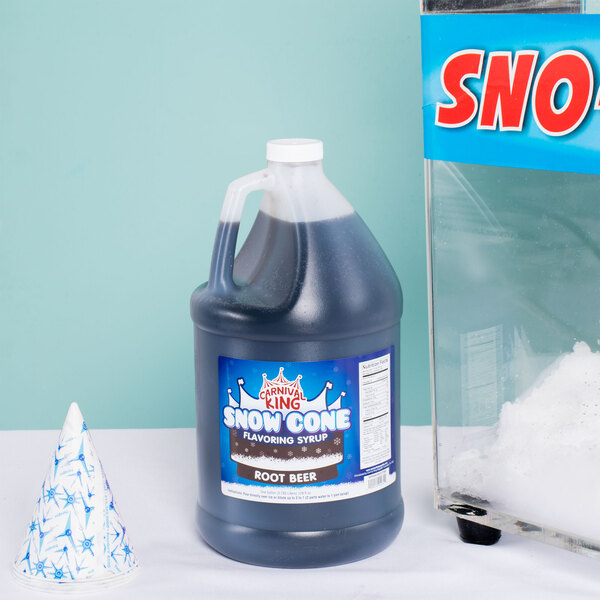 A close-up of a Carnival King 1 gallon jug of root beer snow cone syrup.