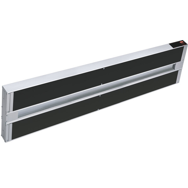 A black and white metal rectangular strip with a button.