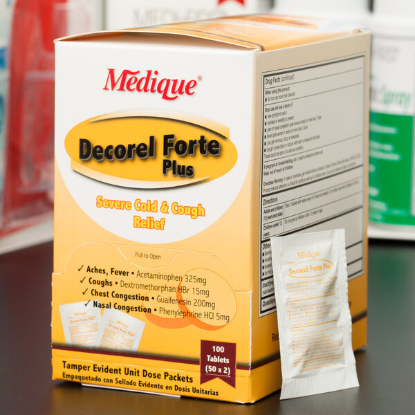 A box of Medique Decorel Forte Plus cold relief tablets on a table.