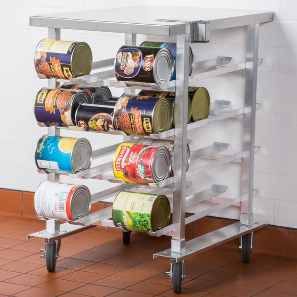 A Regency stainless steel mobile aluminum can rack with cans on it.