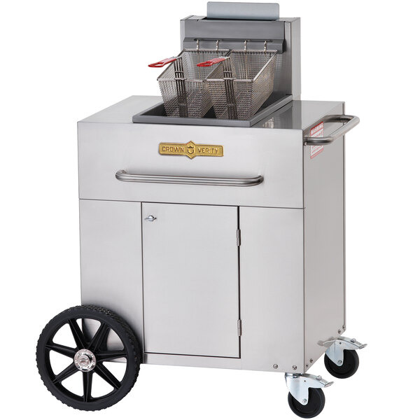 A stainless steel Crown Verity portable fryer on a cart with wheels and a basket on top.