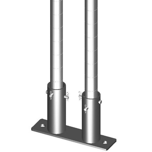 A pair of metal plates with holes on top of a pair of metal poles.