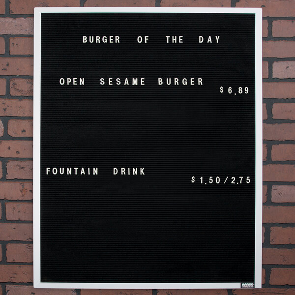 A black Aarco felt message board with white text that says "Burger of the Day"