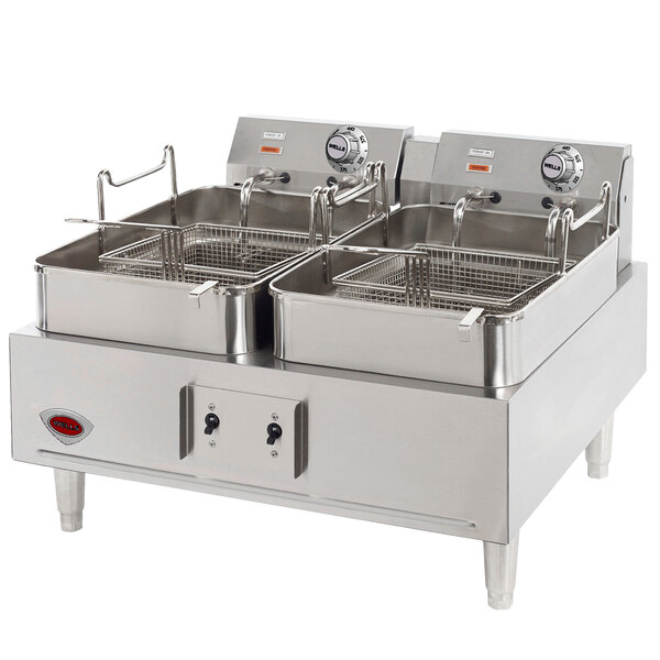 A Wells countertop electric deep fryer with double baskets.