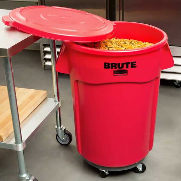 A Rubbermaid red commercial trash can with a lid open.