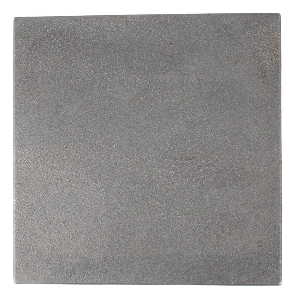 A grey square flat top grill plate with white specks.