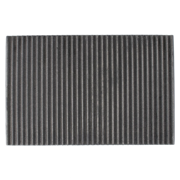 A black rectangular grill plate with grooves on the surface.