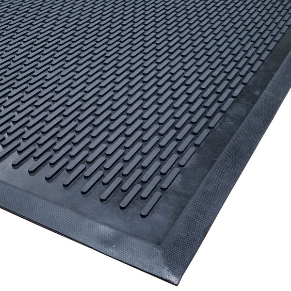 A black rubber Cactus Mat with a grid pattern.