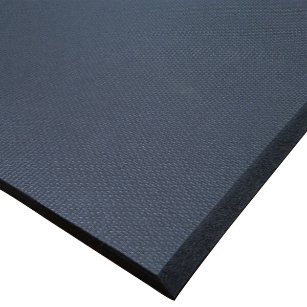 A close up of a black Cactus Mat rubber runner mat.