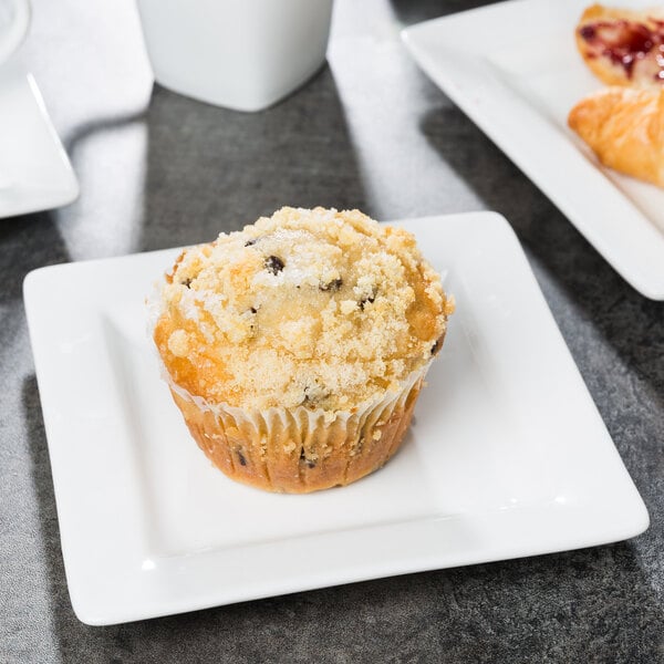 A muffin on a Libbey slate white porcelain plate.
