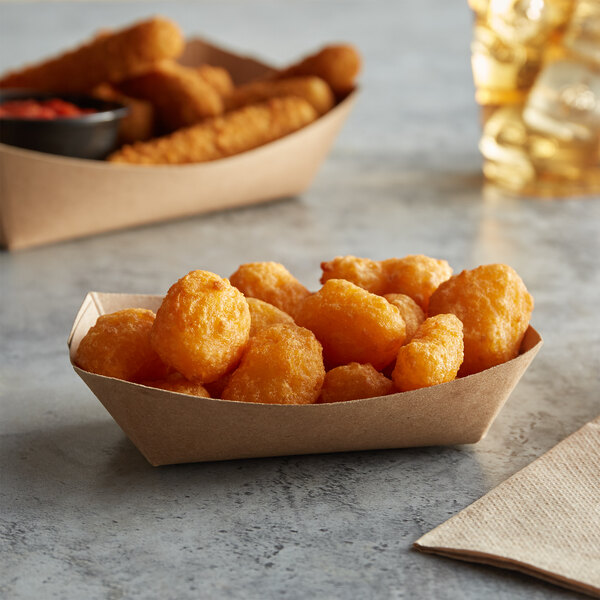 A group of fried food in #40 Natural Eco-Kraft paper food trays.