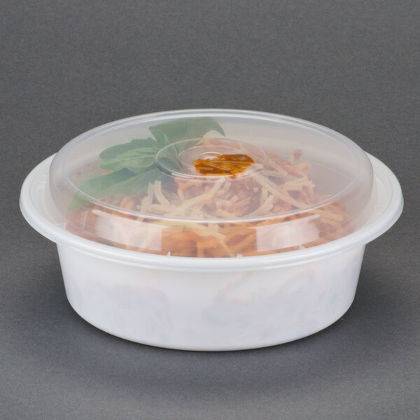 A white Pactiv plastic container with food inside.