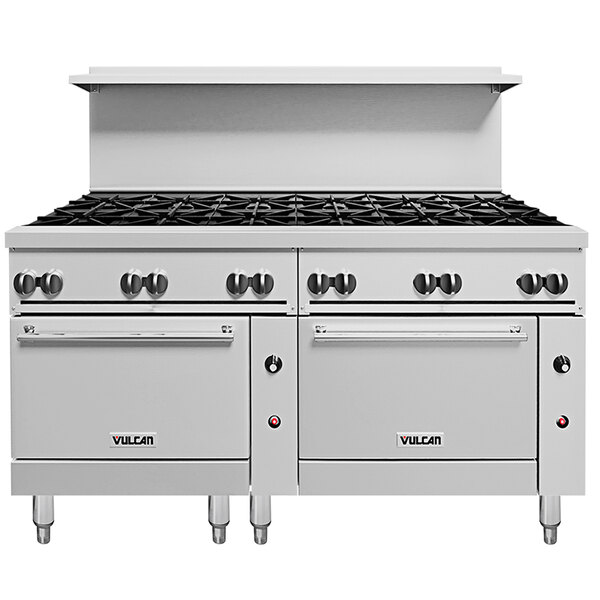 A large stainless steel Vulcan commercial range with black knobs.