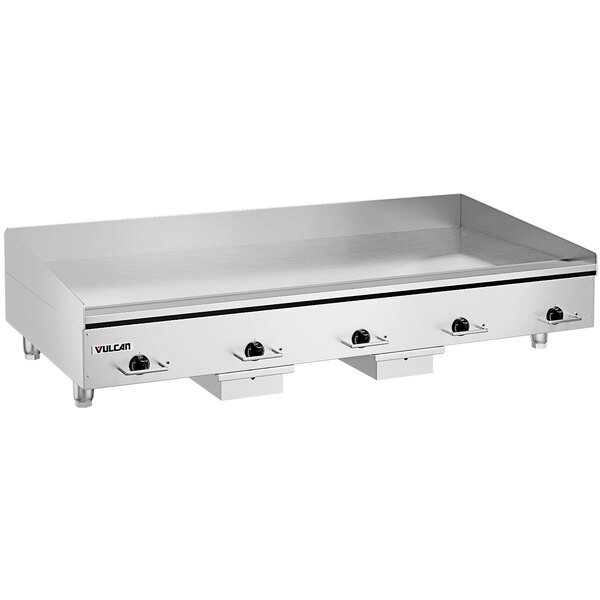 A large stainless steel Vulcan countertop griddle with black knobs.
