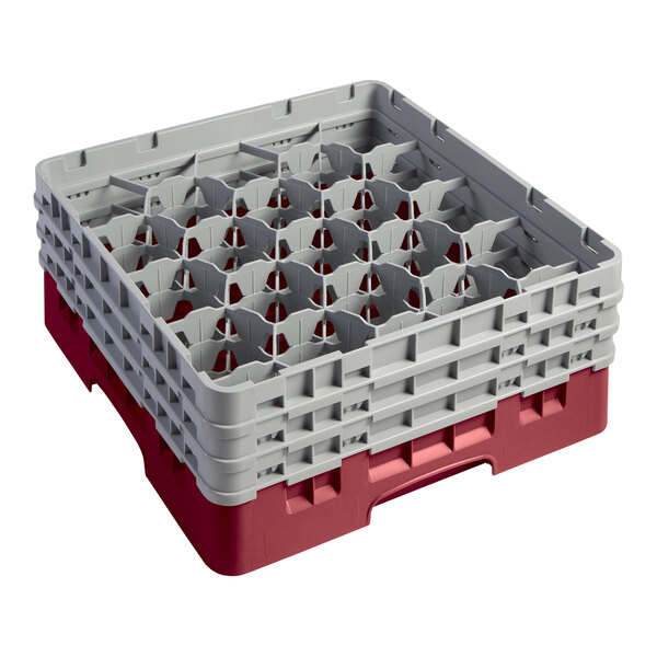 A red plastic Cambro glass rack with extenders and empty compartments.