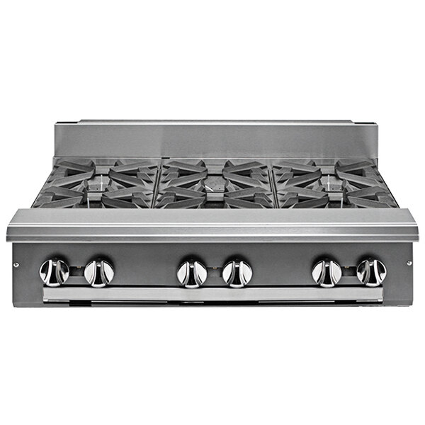 A Vulcan stainless steel liquid propane range with six burners on a counter in a professional kitchen.