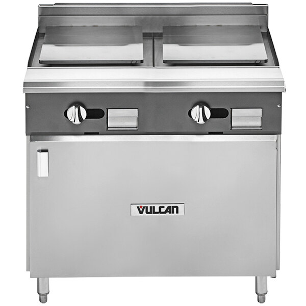 A Vulcan stainless steel commercial range with 2 plancha tops and a cabinet base.