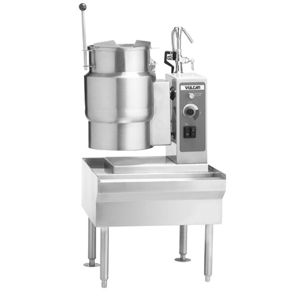 A Vulcan 6 gallon electric tilting kettle with a metal container inside.