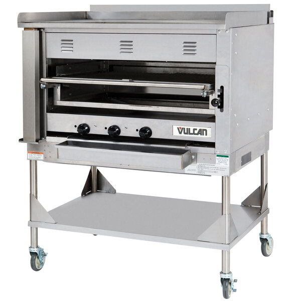 A large stainless steel Vulcan Chophouse Ceramic Broiler on a stand.