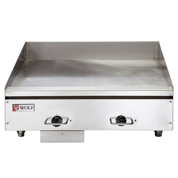 A Wolf stainless steel electric countertop griddle with thermostatic controls.
