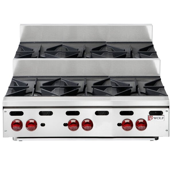 A Wolf stainless steel countertop range with six burners.