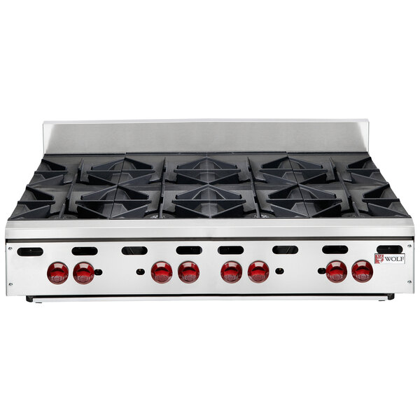 A Wolf stainless steel countertop range with eight burners.