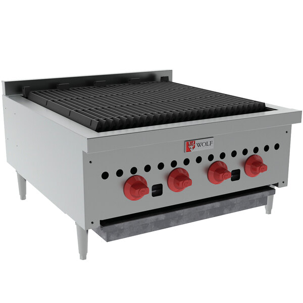 A Wolf Liquid Propane radiant gas charbroiler with red knobs on a counter.