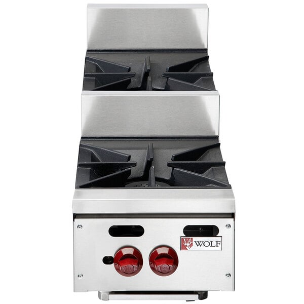 A Wolf stainless steel countertop range with two burners.