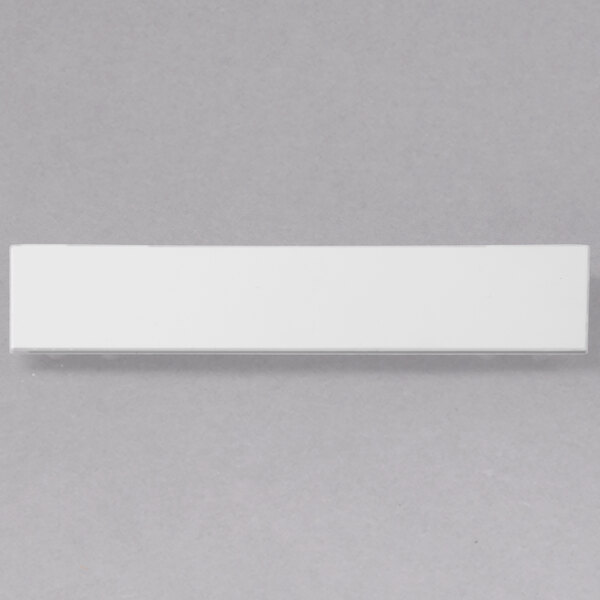 A white rectangular object with a gray border.