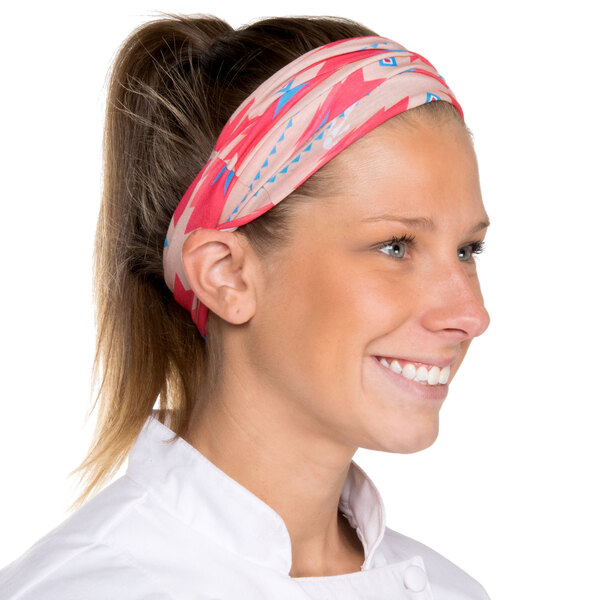A woman wearing a pink Headsweats headband.