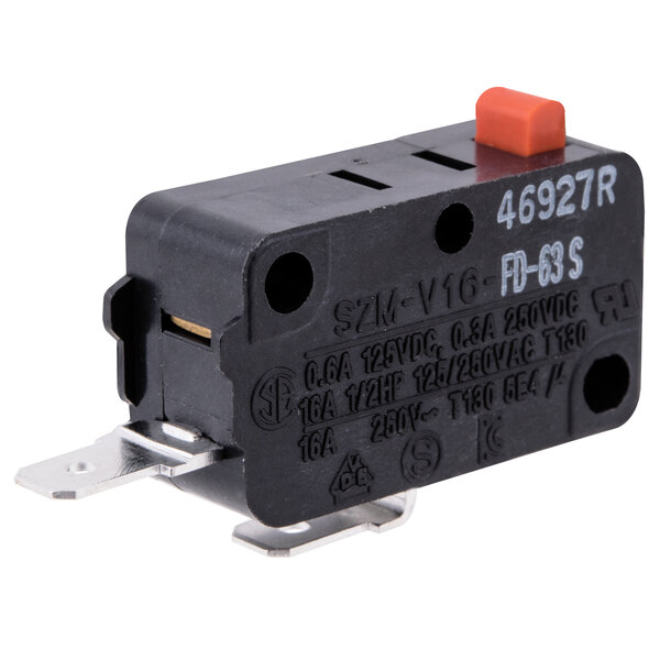 A black and orange Solwave interlock microswitch with an orange button.