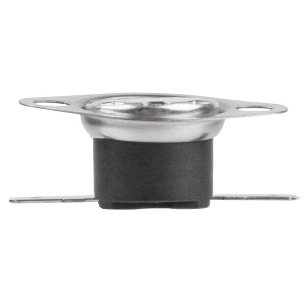 A close-up of a black and silver metal device with a small hole in it.