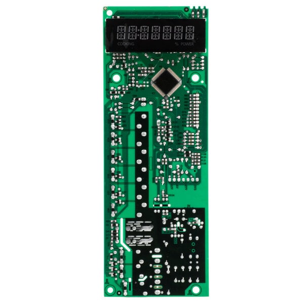 A close-up of a green Solwave PCB board with black and white numbers.