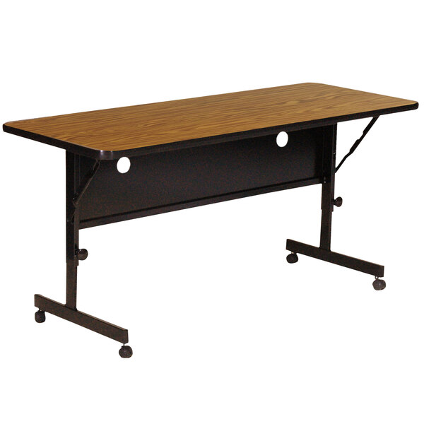A brown rectangular Correll seminar table with wheels.