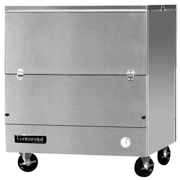 A stainless steel Continental Refrigerator milk cooler on wheels with a door.