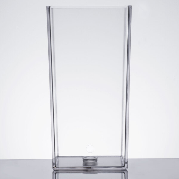A clear rectangular plastic chamber with a hole.