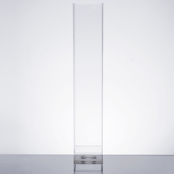A clear rectangular object on a table with a white background.