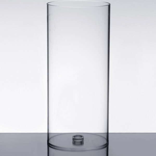 A clear cylinder with a metal lid and a small hole.
