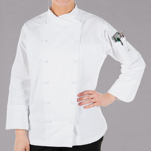 A woman wearing a white Mercer Culinary chef jacket.