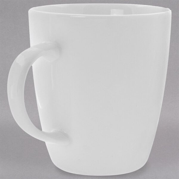 A close-up of a 10 Strawberry Street Bistro white porcelain mug with a handle.